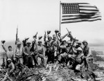 In a second photo Rosenthal shot at Iwo Jima, Marines pose in front of the flag they just raised. (AP Photo/Joe Rosenthal)